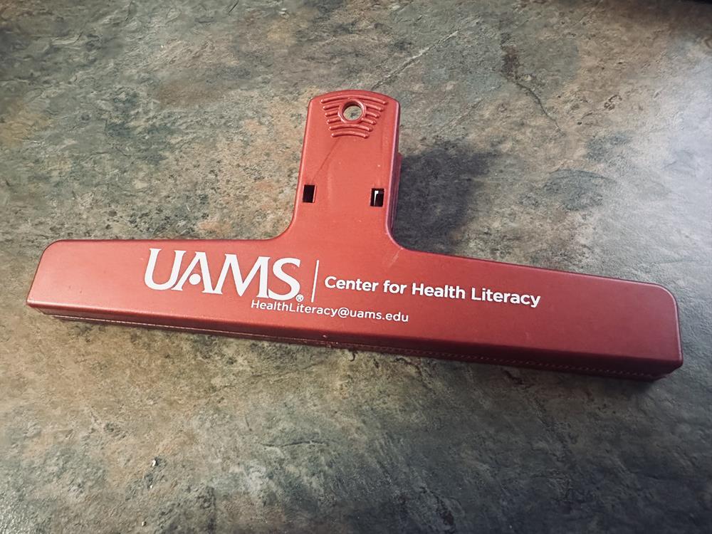 Customer photo from Lacey of our Keep-it Clip - 6" - Metallic, a red object on a marble surface